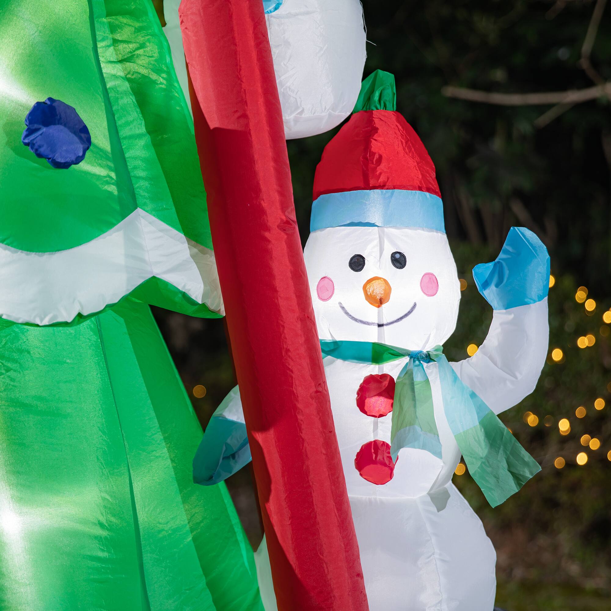 Glitzhome® 8ft. Lighted Inflatable Xmas Snowman Climbing Up Tree Décor